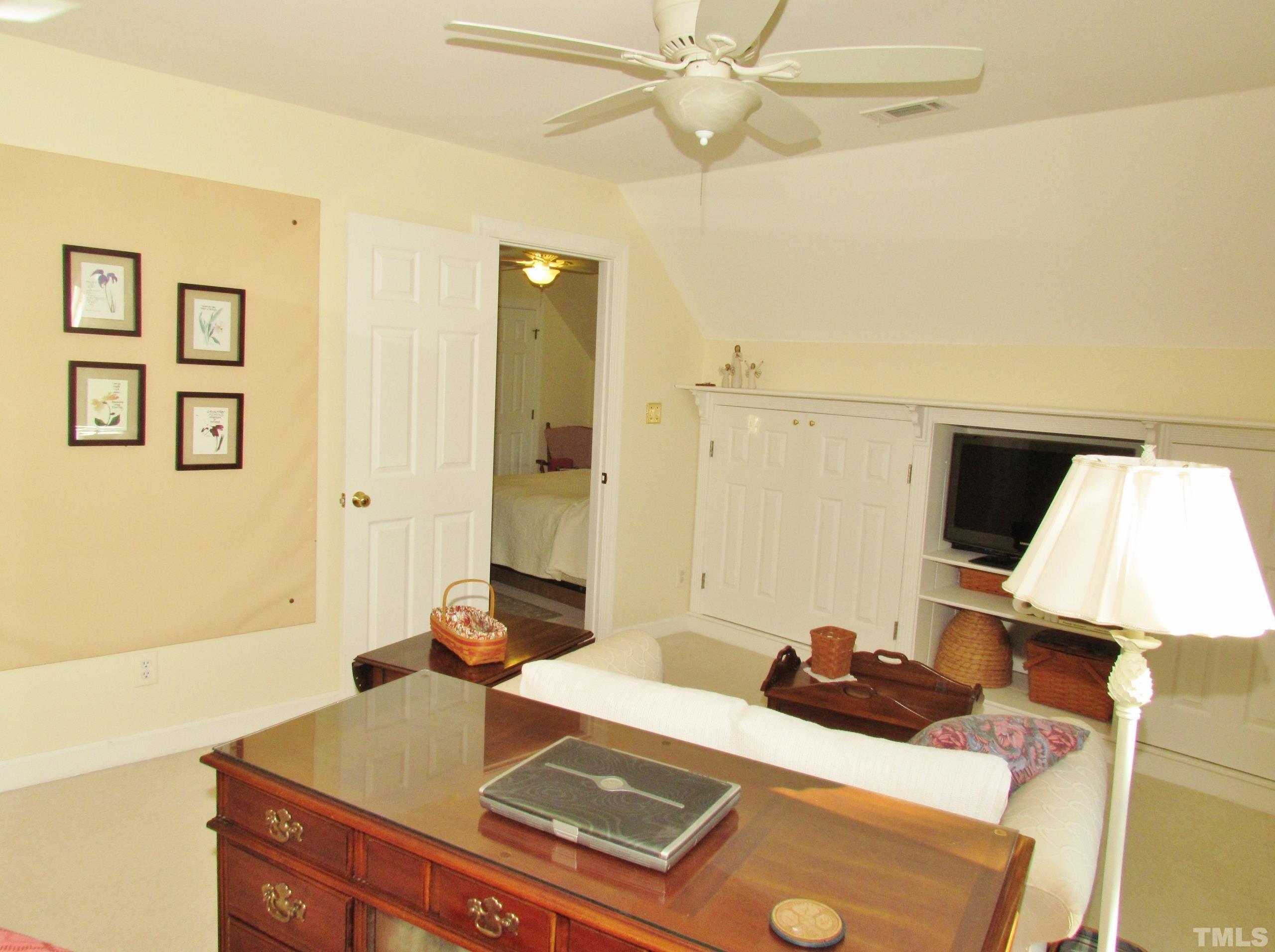 12001 Pembridge Lane Raleigh, NC 27613 - Photo 36 of 53 a room with a couch and a view of living room
