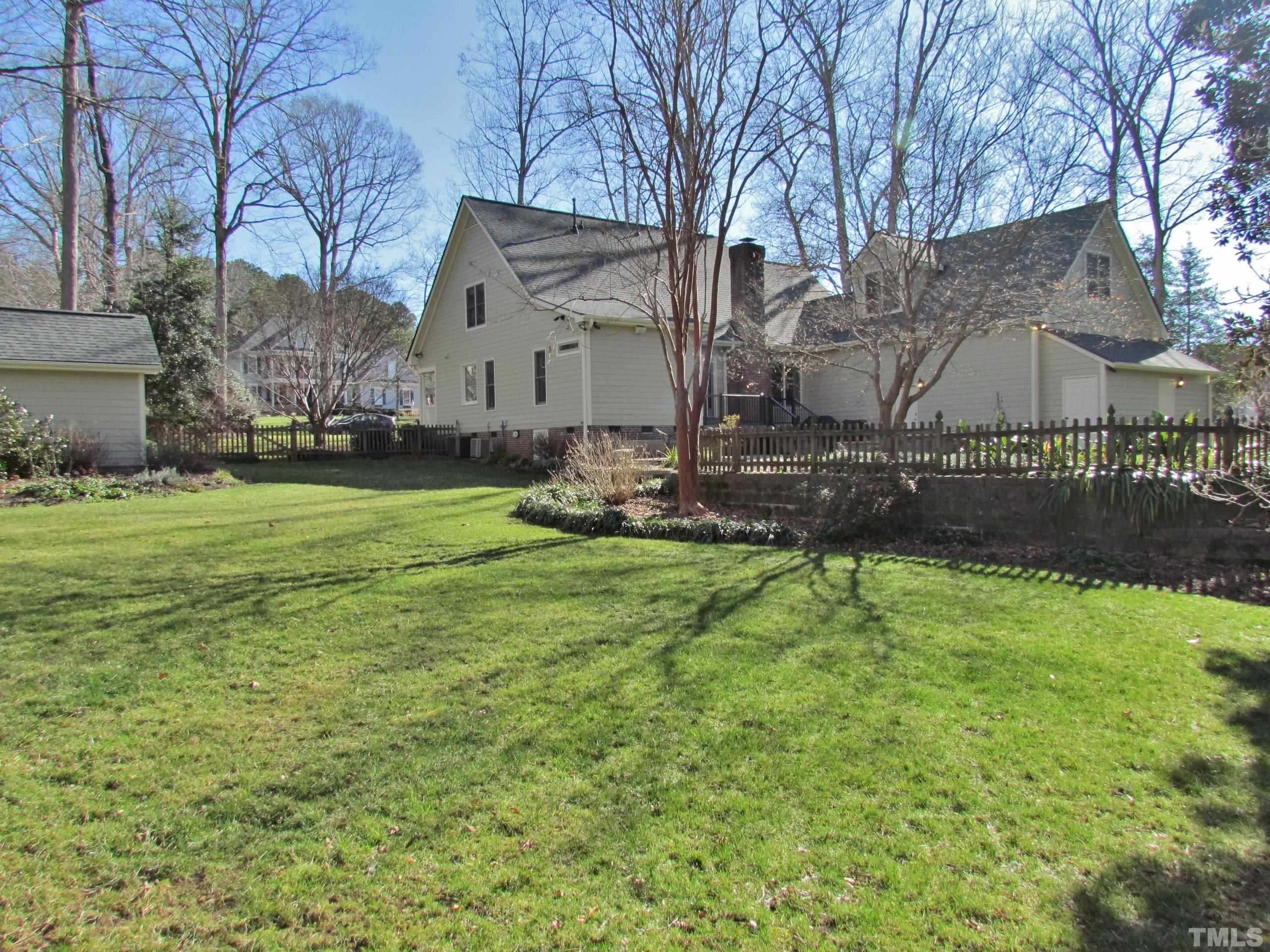 12001 Pembridge Lane Raleigh, NC 27613 - Photo 4 of 53 a view of a house with a yard