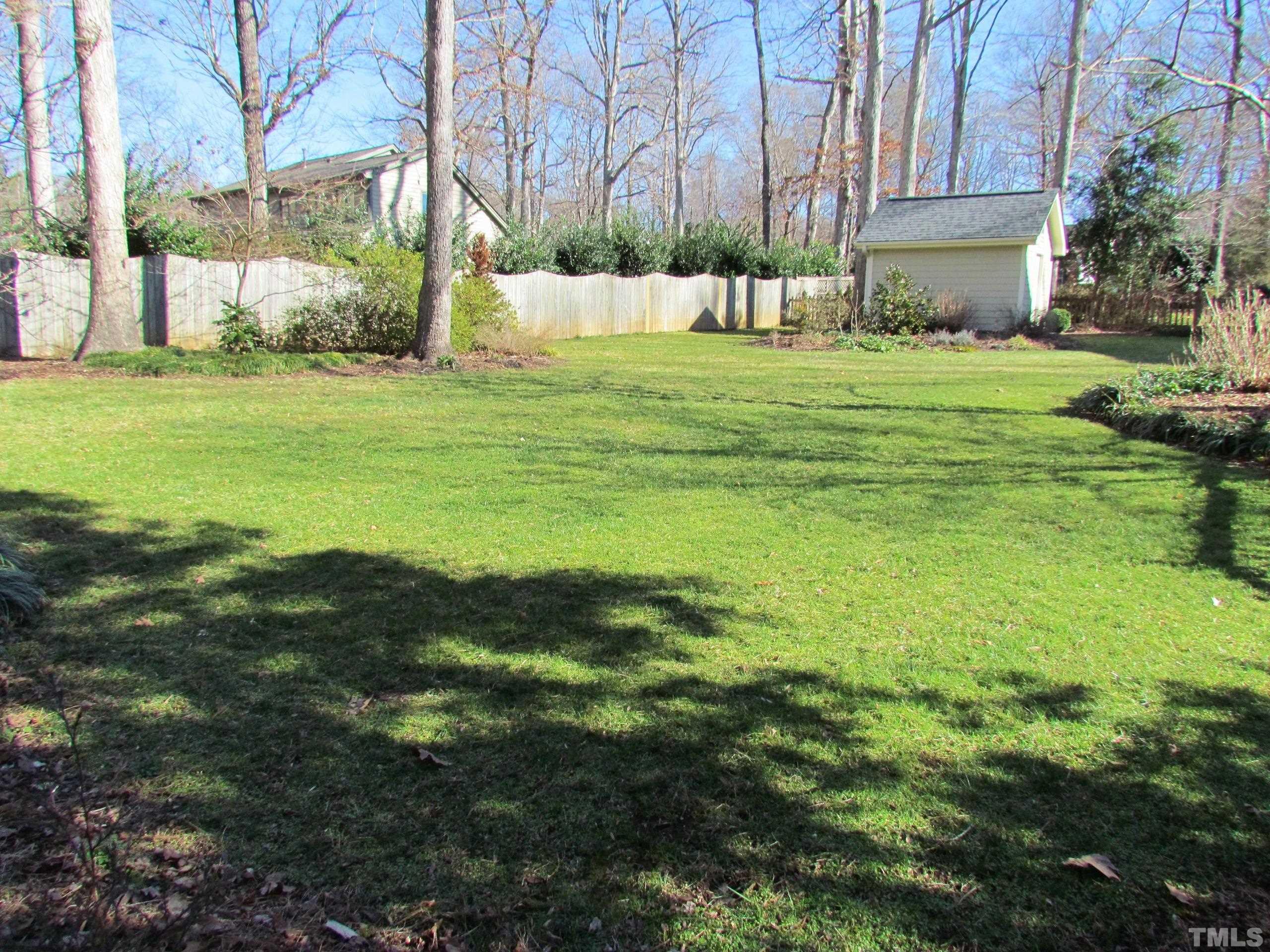 12001 Pembridge Lane Raleigh, NC 27613 - Photo 41 of 53 a big yard with lots of green space
