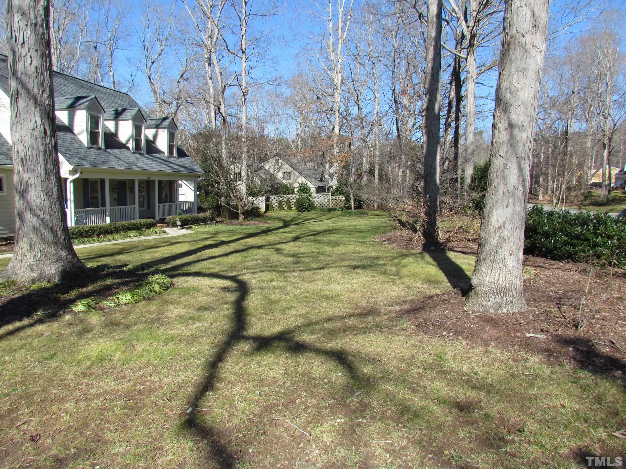 12001 Pembridge Lane Raleigh, NC 27613 - Photo 45 of 53 a view of a yard in front of a building