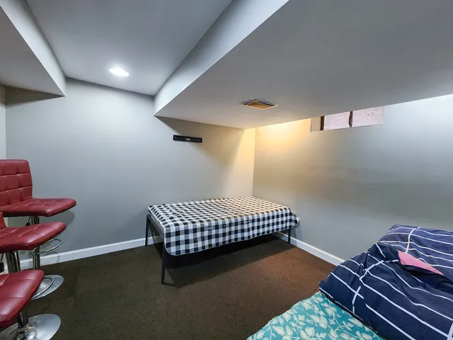 a room with chairs and wooden floor