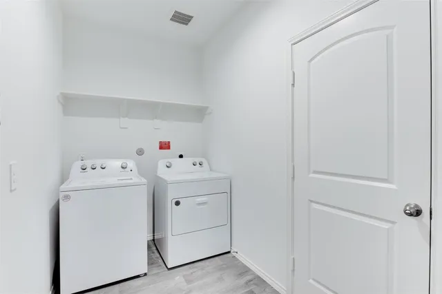 a bathroom with a sink mirror and toilet