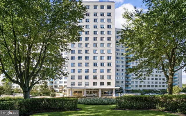 a view of a large building with a yard