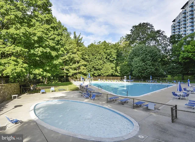 a view of a swimming pool with a patio