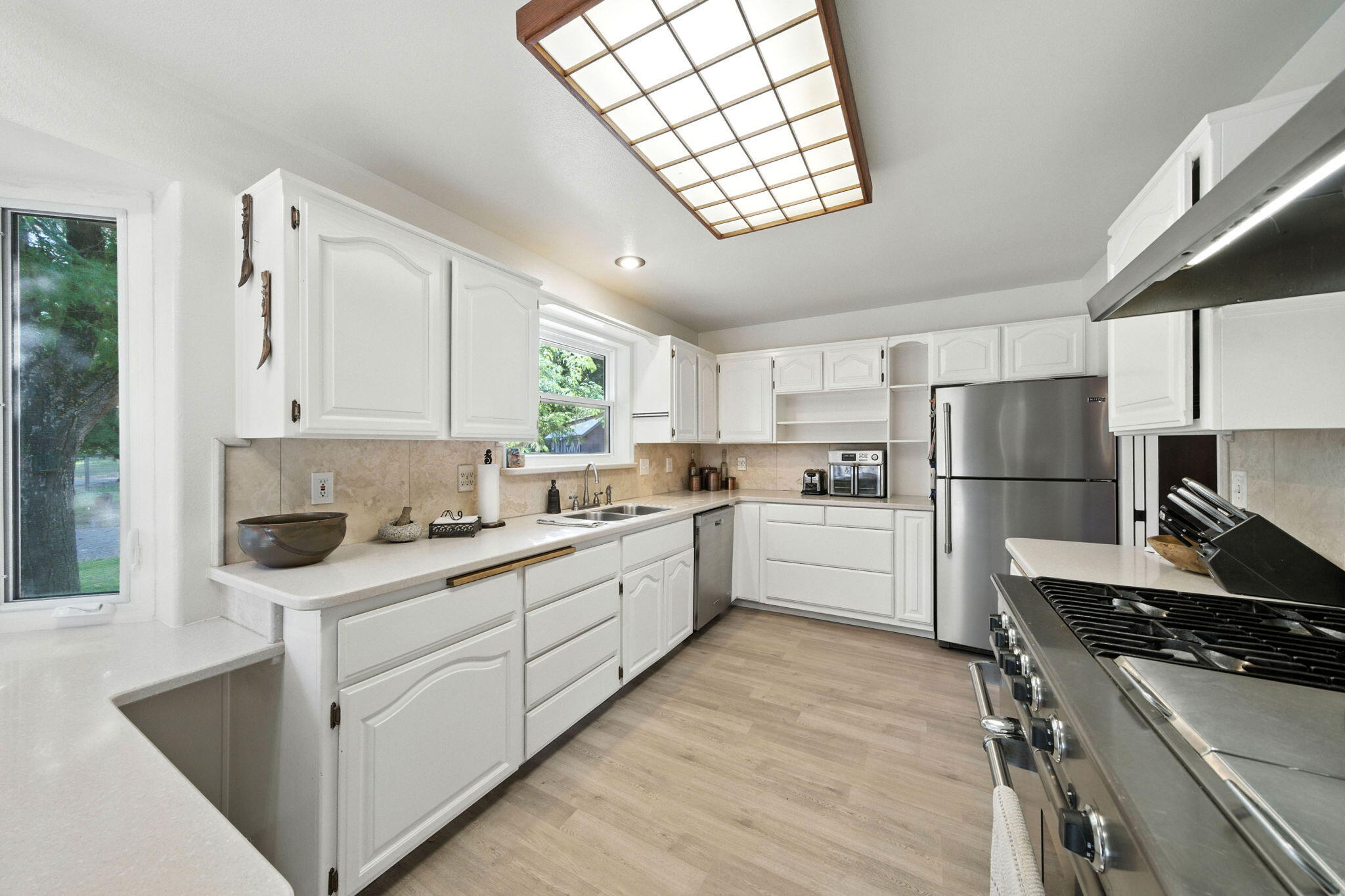 61 Chief George Lewiston, CA 96052 - Photo 28 of 101 a kitchen with white cabinets and appliances