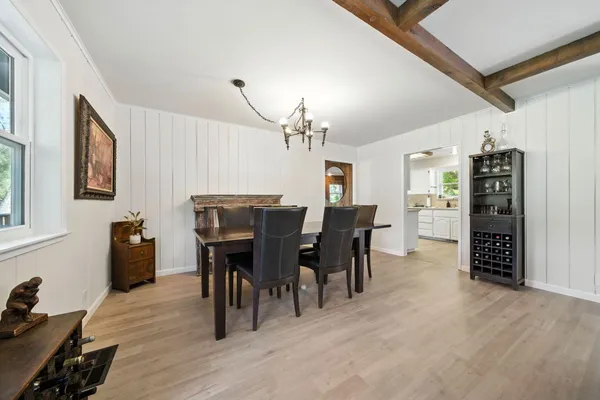 a view of a house with a yard and tree s