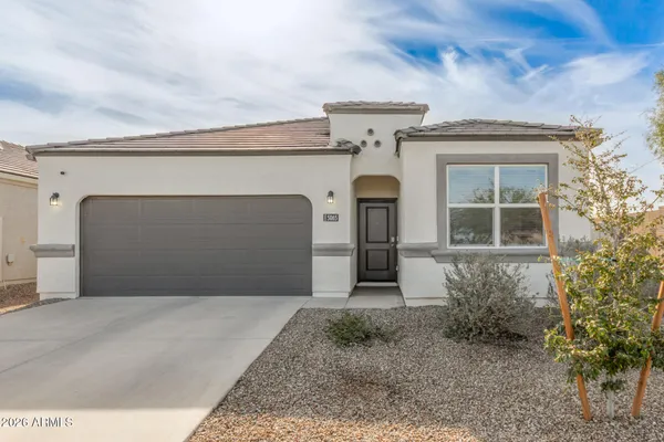 a front view of a house with a garage