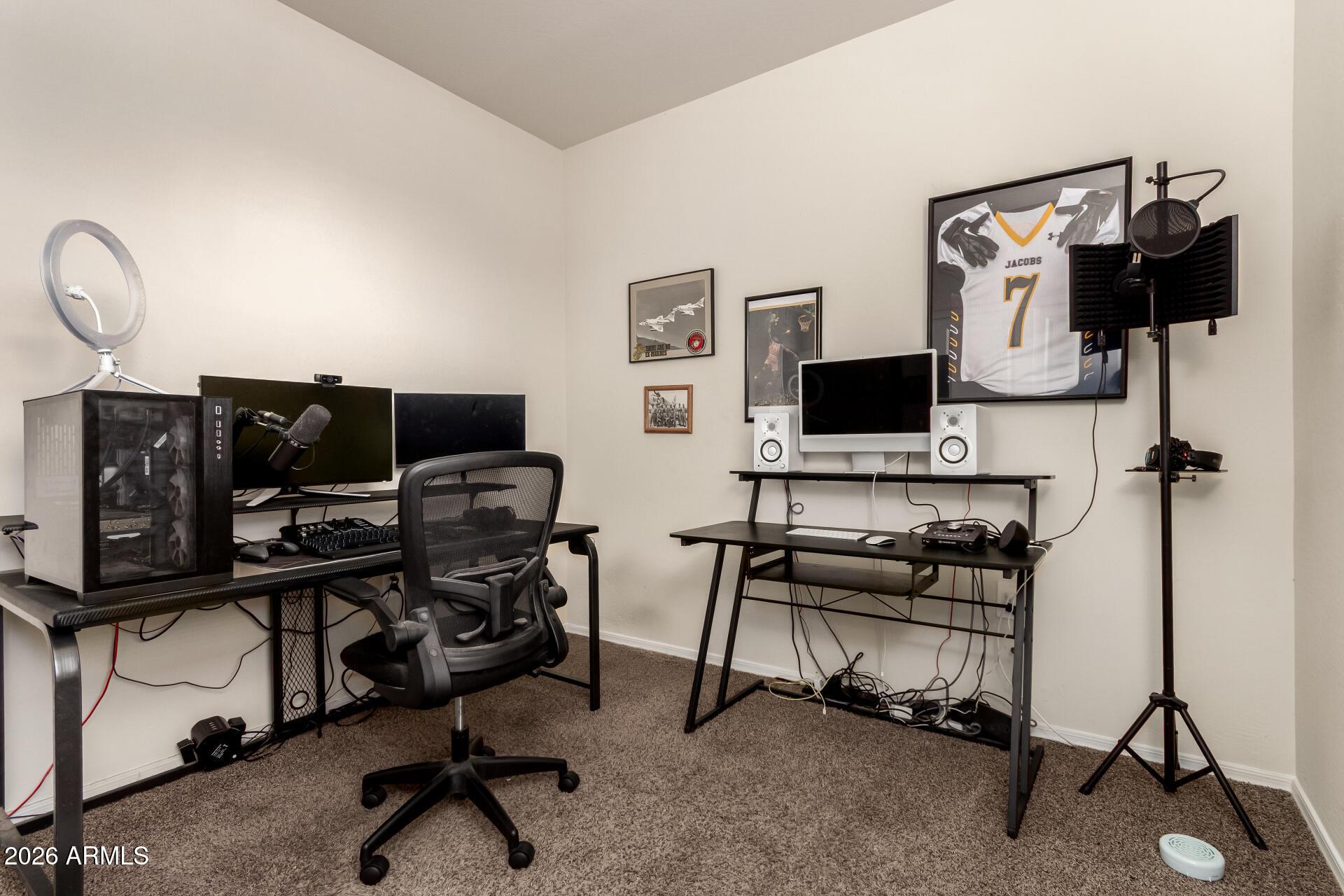 5065 East Emery Road San Tan Valley, AZ 85143 - Photo 19 of 33 a view of a workspace with furniture and a flat screen tv