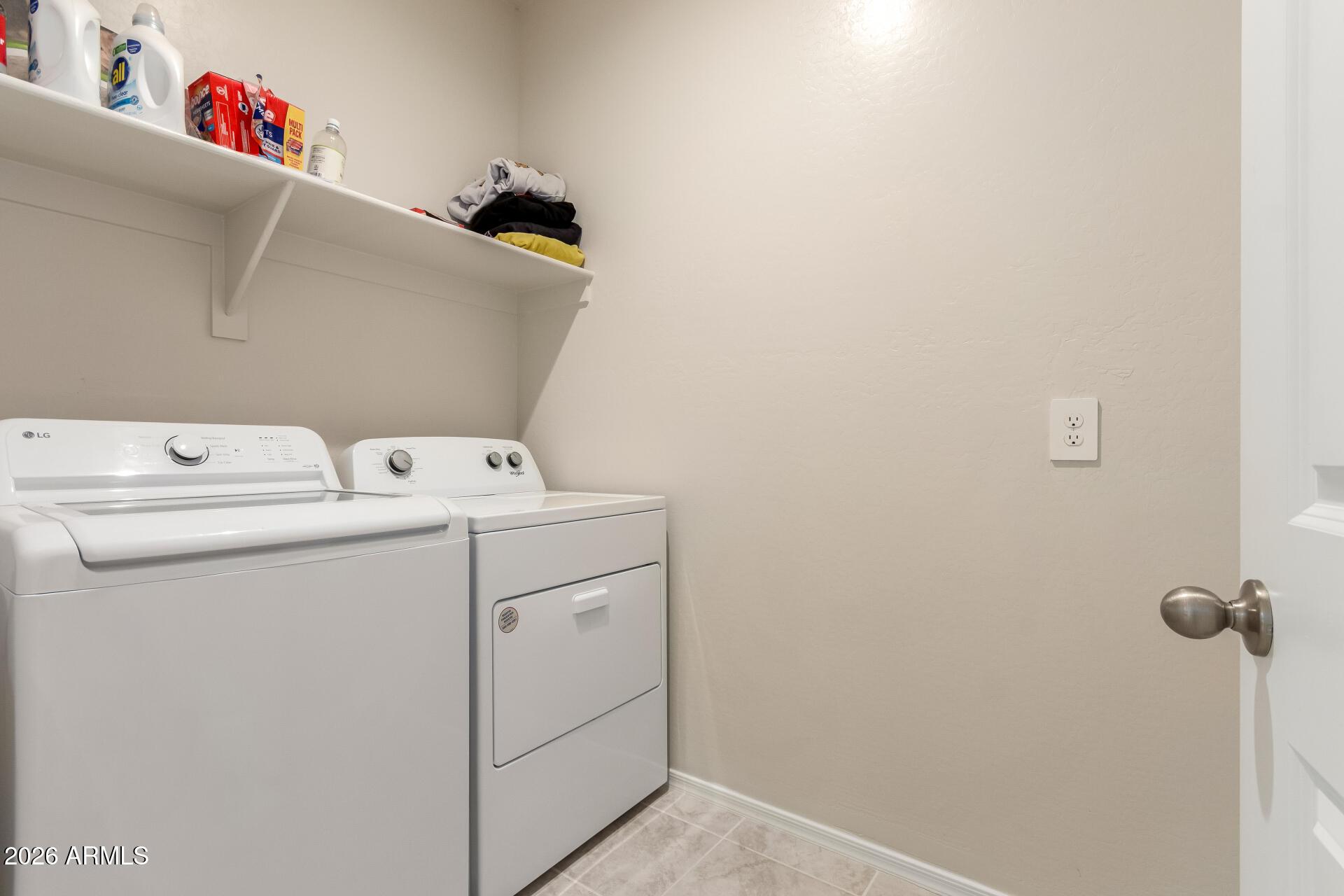 5065 East Emery Road San Tan Valley, AZ 85143 - Photo 23 of 33 a utility room with dryer and washer