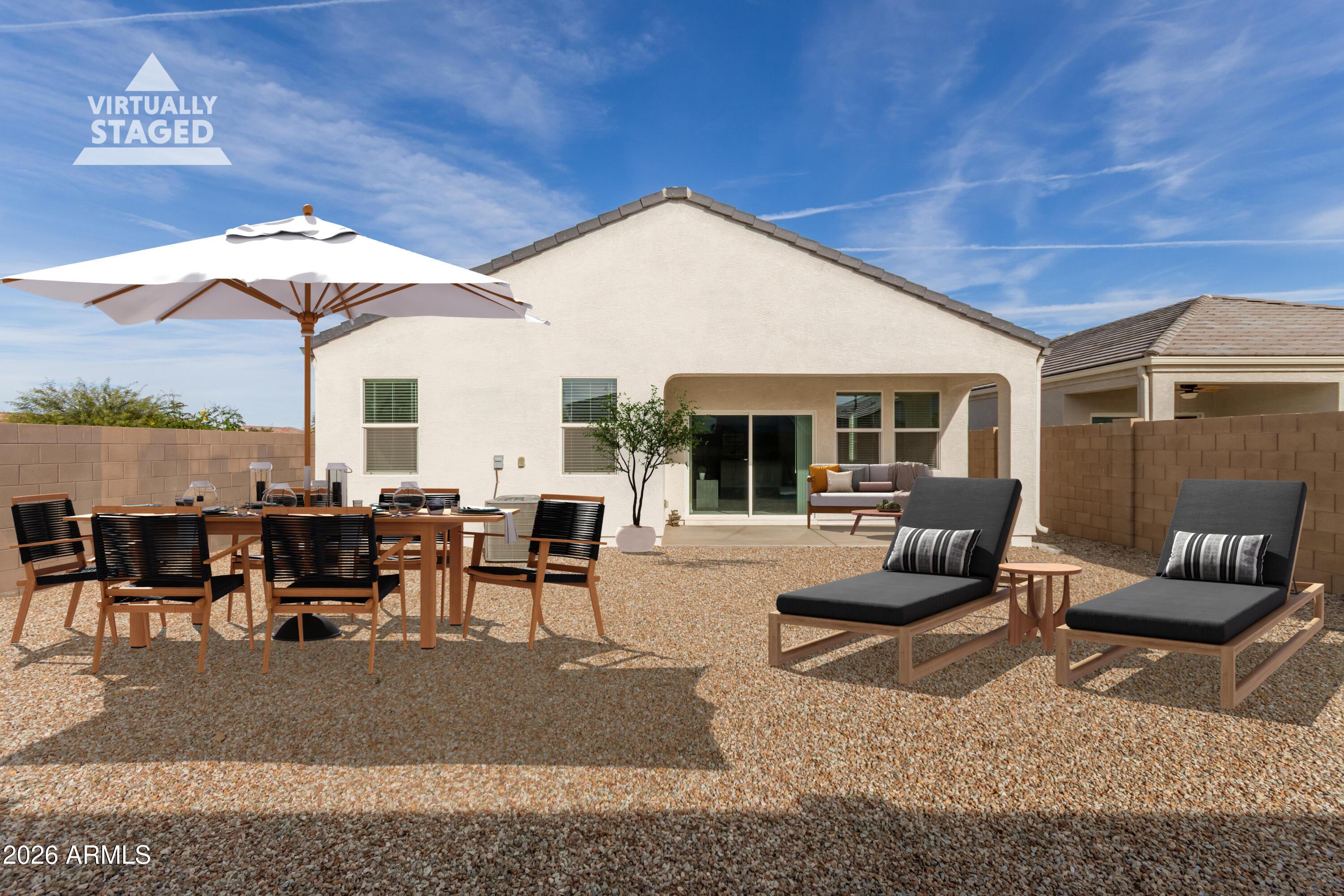 5065 East Emery Road San Tan Valley, AZ 85143 - Photo 24 of 33 a living room with furniture potted plant and a large window