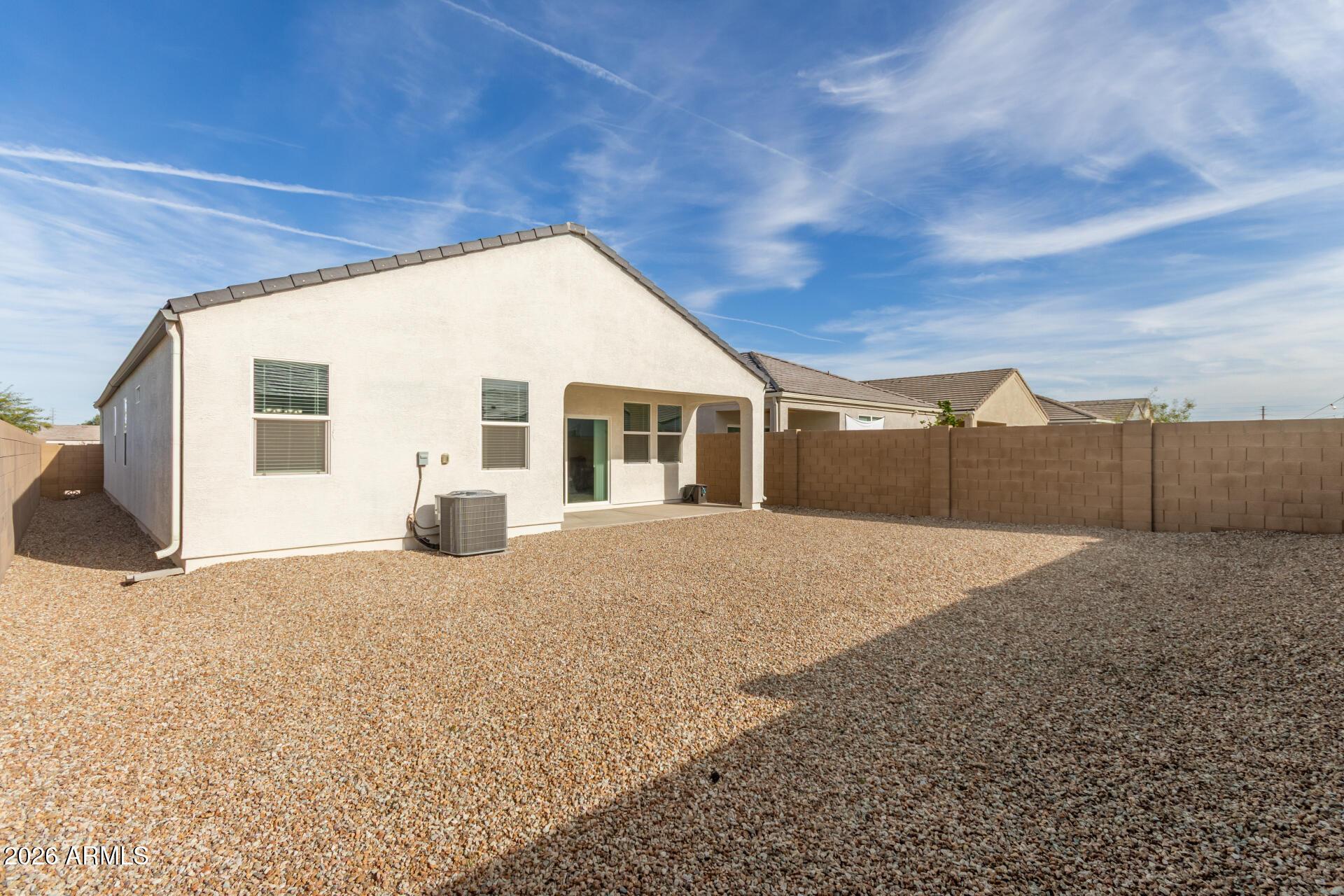 5065 East Emery Road San Tan Valley, AZ 85143 - Photo 27 of 33 a view of a house with a backyard