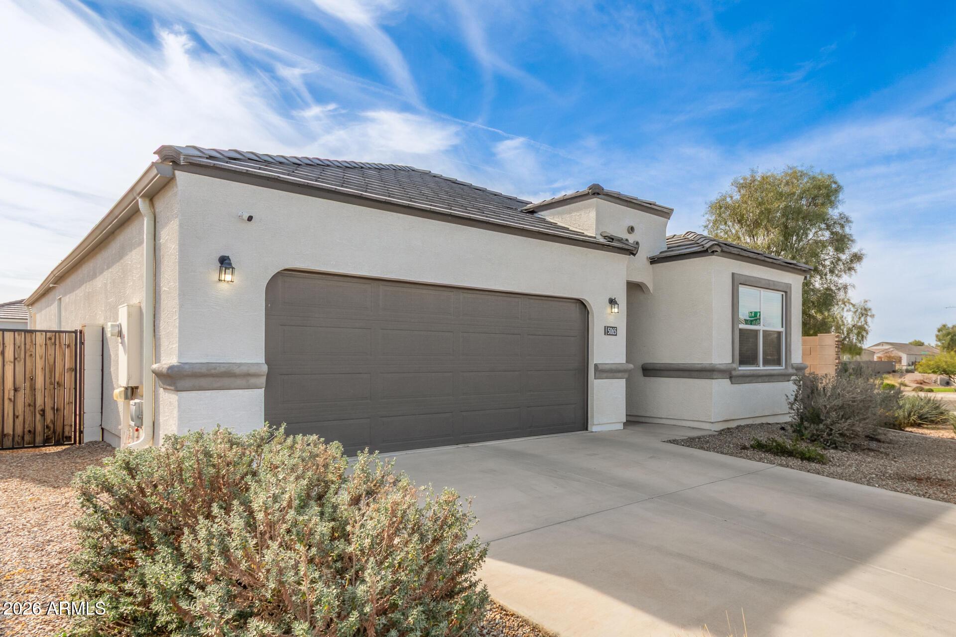 5065 East Emery Road San Tan Valley, AZ 85143 - Photo 32 of 33 a front view of a house with a garage