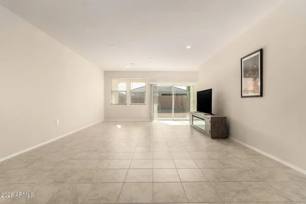 a view of a livingroom with furniture and a flat screen tv
