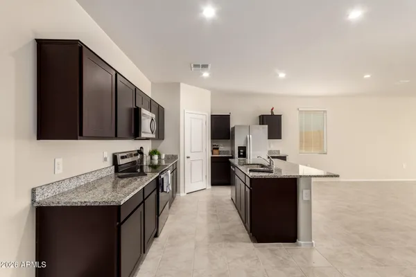 a kitchen with counter top space and appliances
