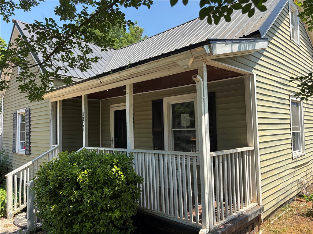 1309 Gilmer Street Anderson, SC 29621 - Photo 6 of 15 This charming home features a welcoming porch, perfect for enjoying peaceful moments outdoors.