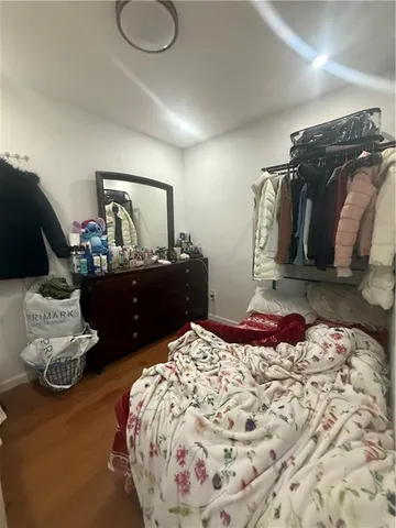 a bedroom with a bed and dresser