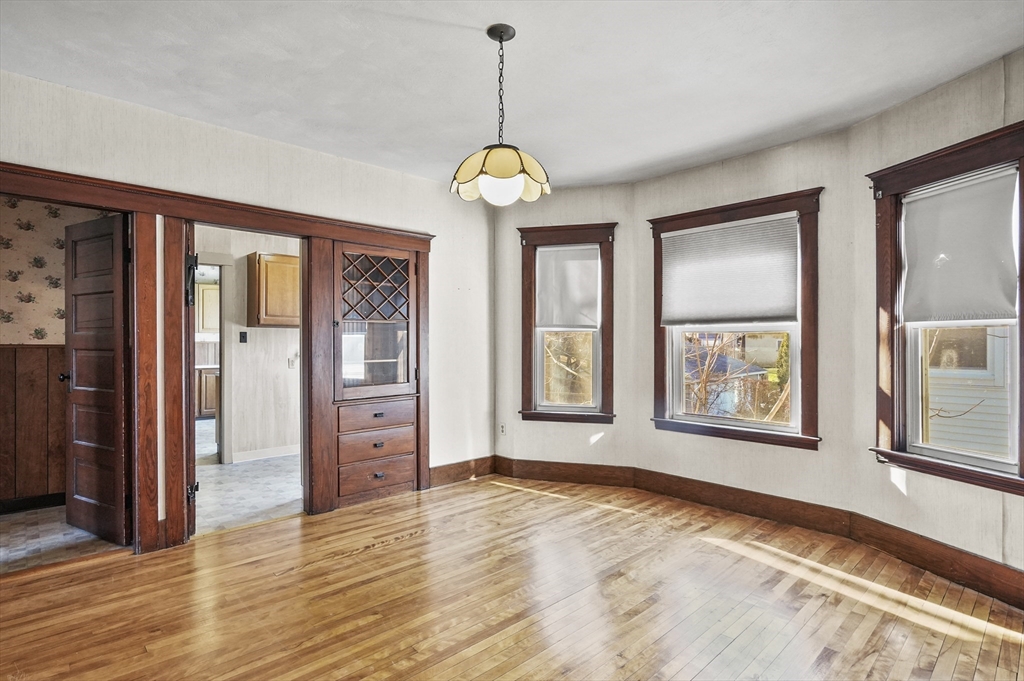 3 Clearview Avenue Worcester, MA 01605 - Photo 29 of 42 a view of an empty room with wooden floor and windows
