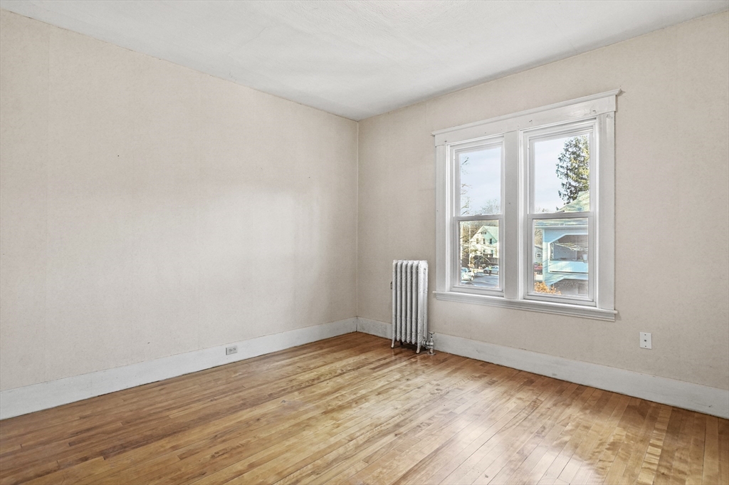 3 Clearview Avenue Worcester, MA 01605 - Photo 34 of 42 an empty room with wooden floor and windows