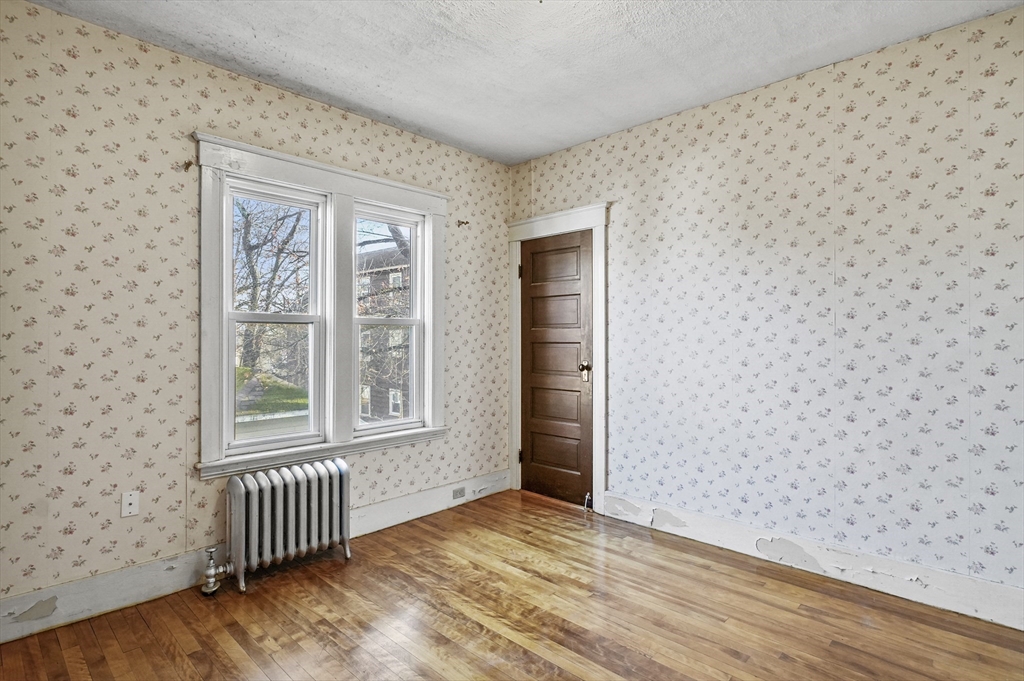 3 Clearview Avenue Worcester, MA 01605 - Photo 36 of 42 an empty room with wooden floor and windows