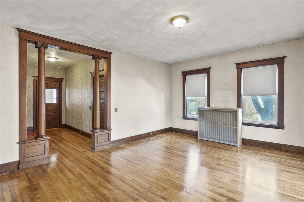 3 Clearview Avenue Worcester, MA 01605 - Photo 6 of 42 an empty room with wooden floor and windows