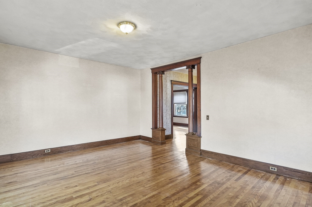 3 Clearview Avenue Worcester, MA 01605 - Photo 8 of 42 a view of an empty room with wooden floor and a window