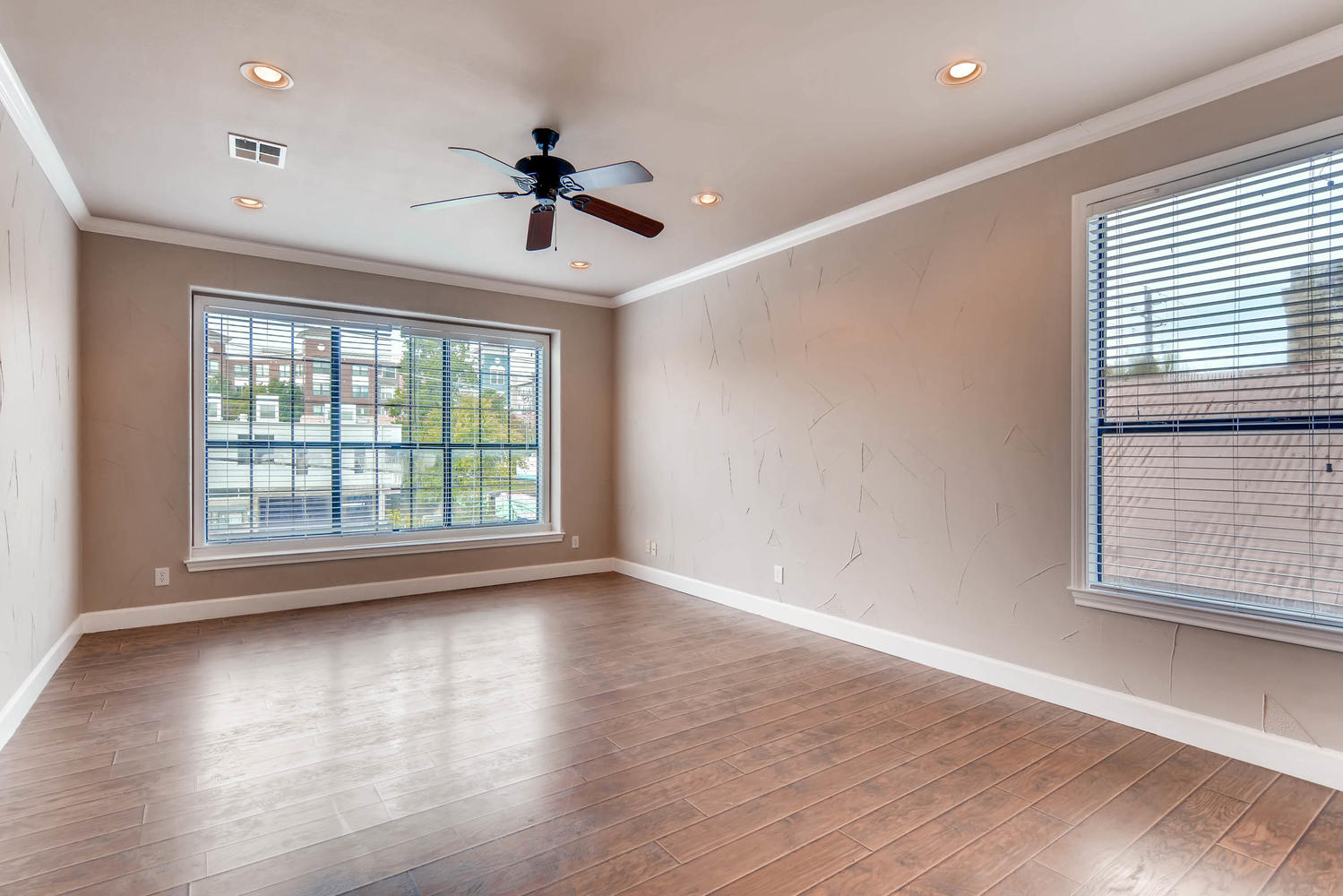 906 Juniper Street Austin, TX 78702 - Photo 15 of 28 a view of an empty room with wooden floor and a window