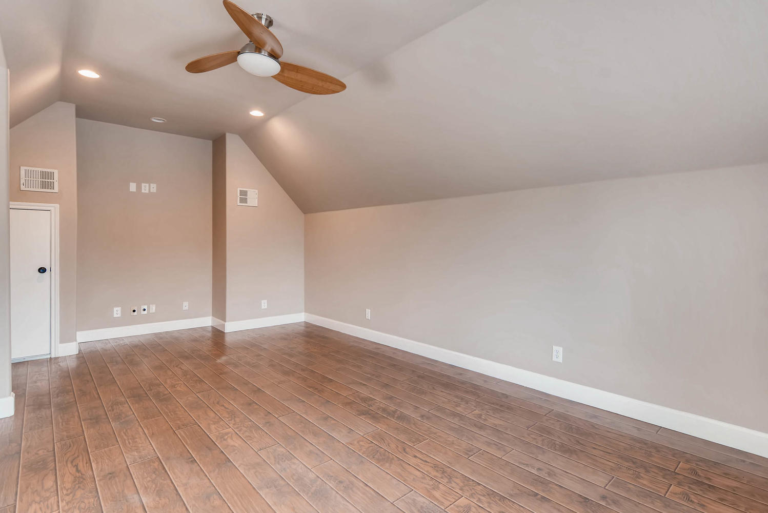 906 Juniper Street Austin, TX 78702 - Photo 25 of 28 a view of an empty room with wooden floor