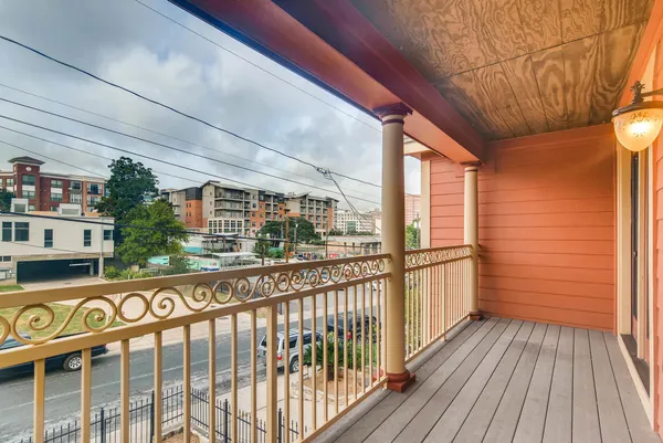 a view of a street from a balcony