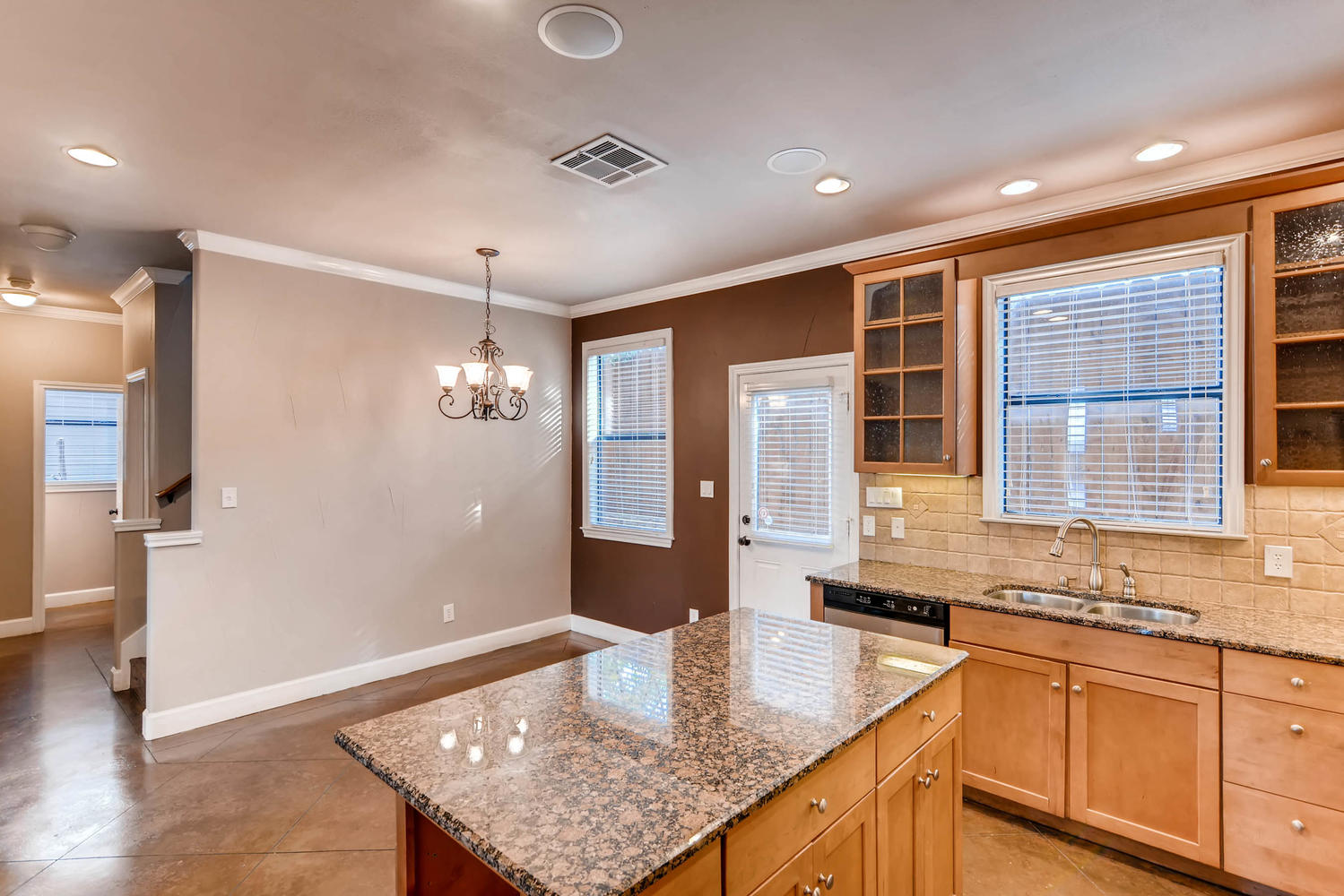 906 Juniper Street Austin, TX 78702 - Photo 9 of 28 a kitchen with sink refrigerator and microwave