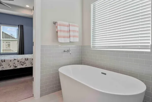a bathroom with a bathtub and a sink