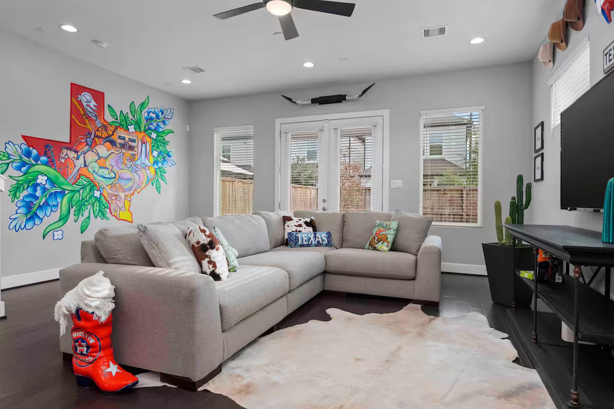 4202 Gillespie Street, Unit A Houston, TX 77020 - Photo 4 of 20 a living room with furniture and a flat screen tv