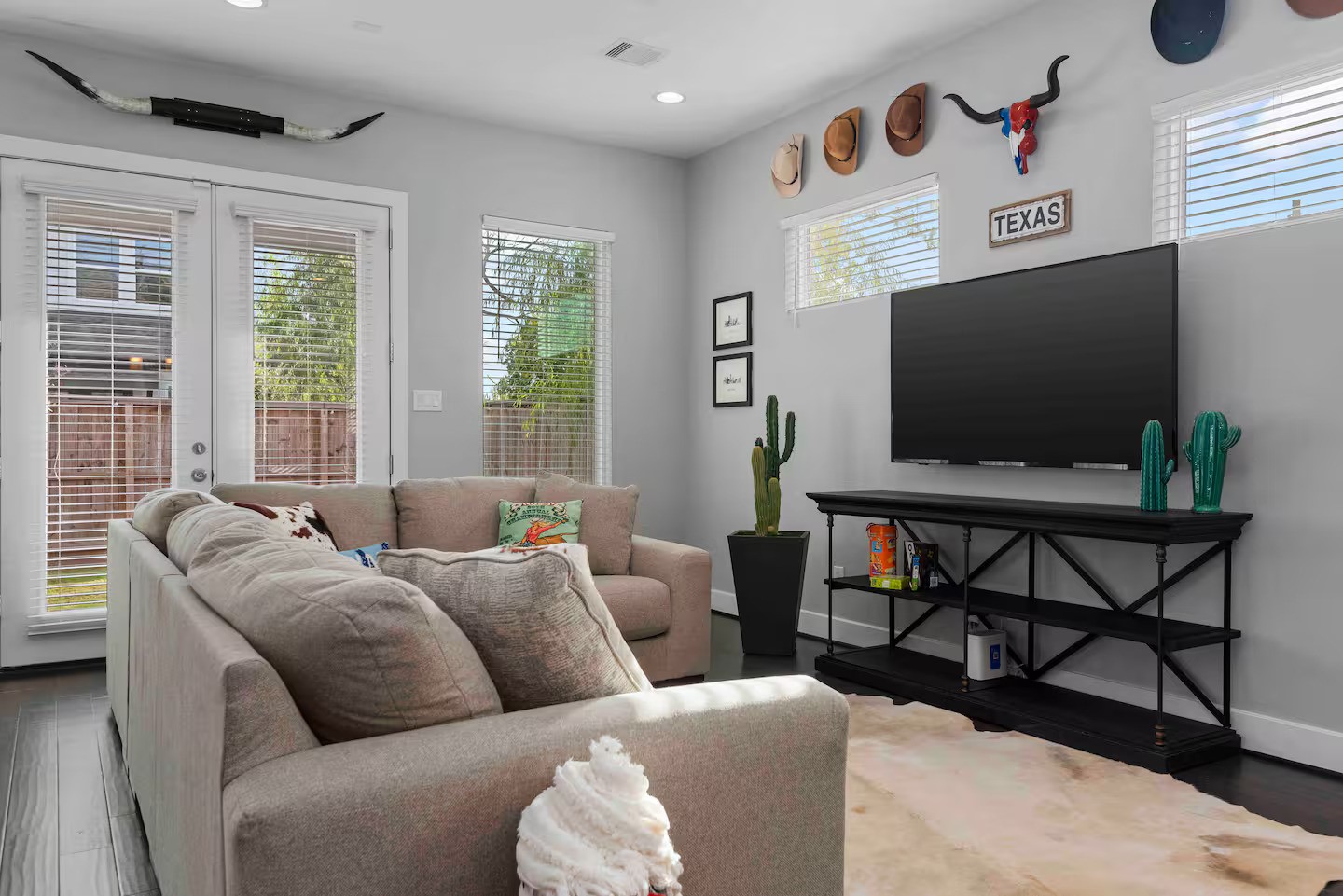 4202 Gillespie Street, Unit A Houston, TX 77020 - Photo 5 of 20 a living room with furniture and a flat screen tv
