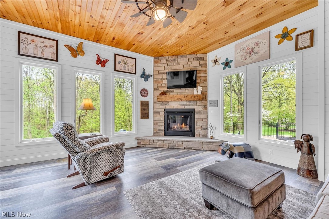 41264 Ravines Edge Way Lagrange, OH 44050 - Photo 16 of 43 Sun room with fireplace,wood ceilings ,beautiful views and access to deck.