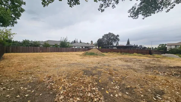 a view of a lake with houses in the back