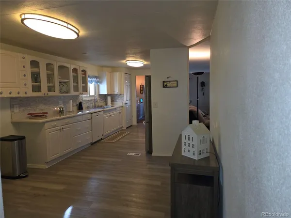 a kitchen with sink cabinets and stainless steel appliances