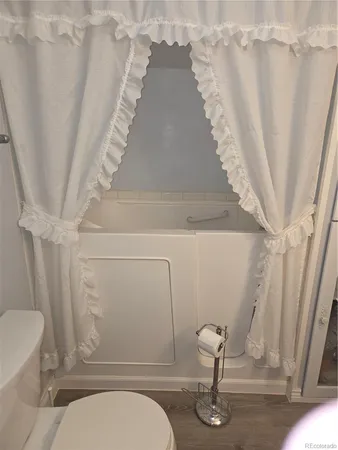 a view of a bedroom with furniture