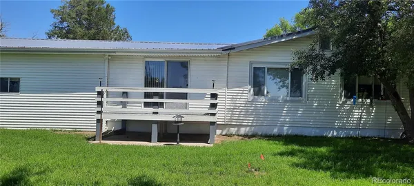 a view of backyard with green space