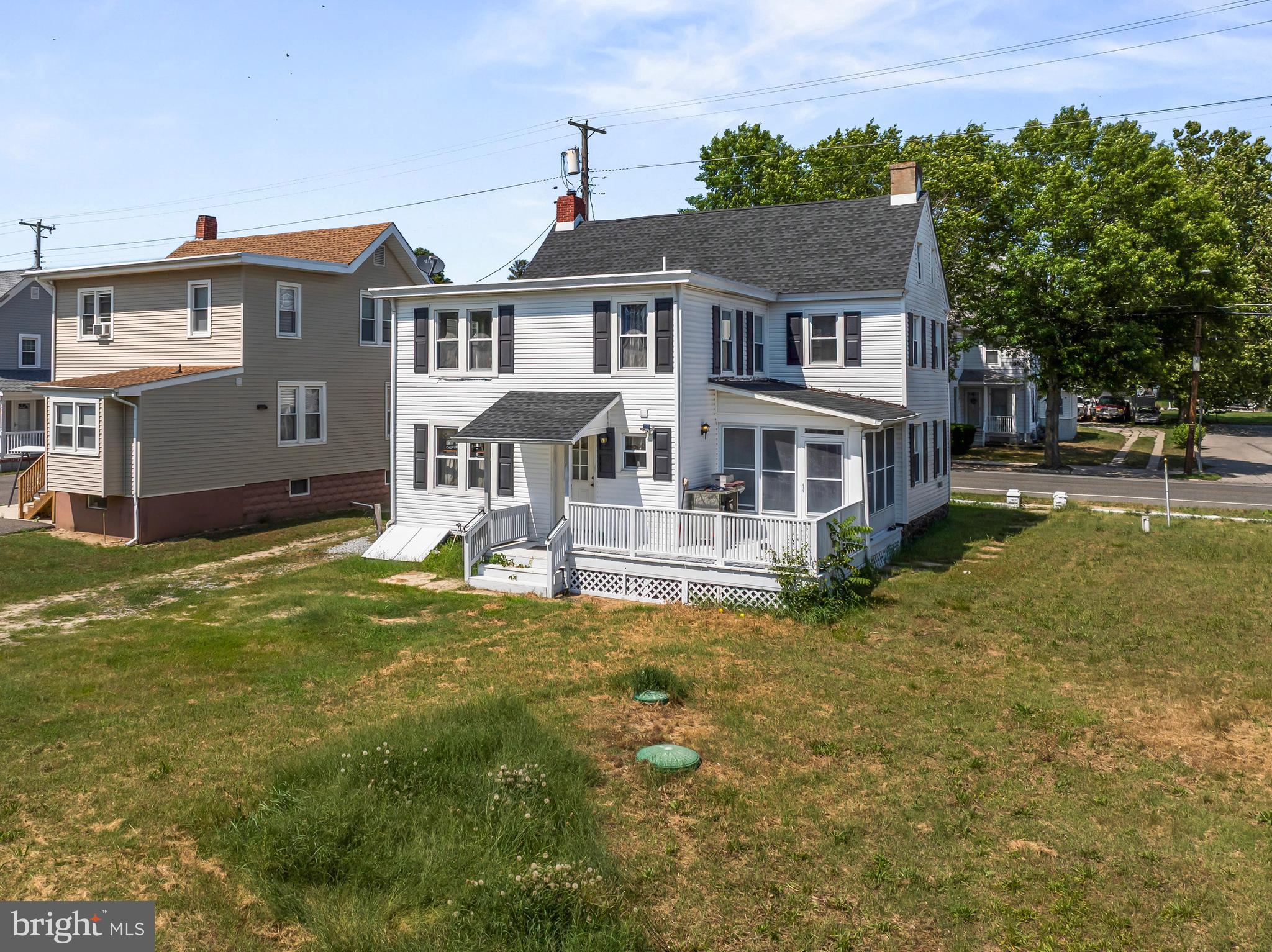 348 Main Street Cedarville, NJ 08311 - Photo 3 of 9 front view of a house with a yard