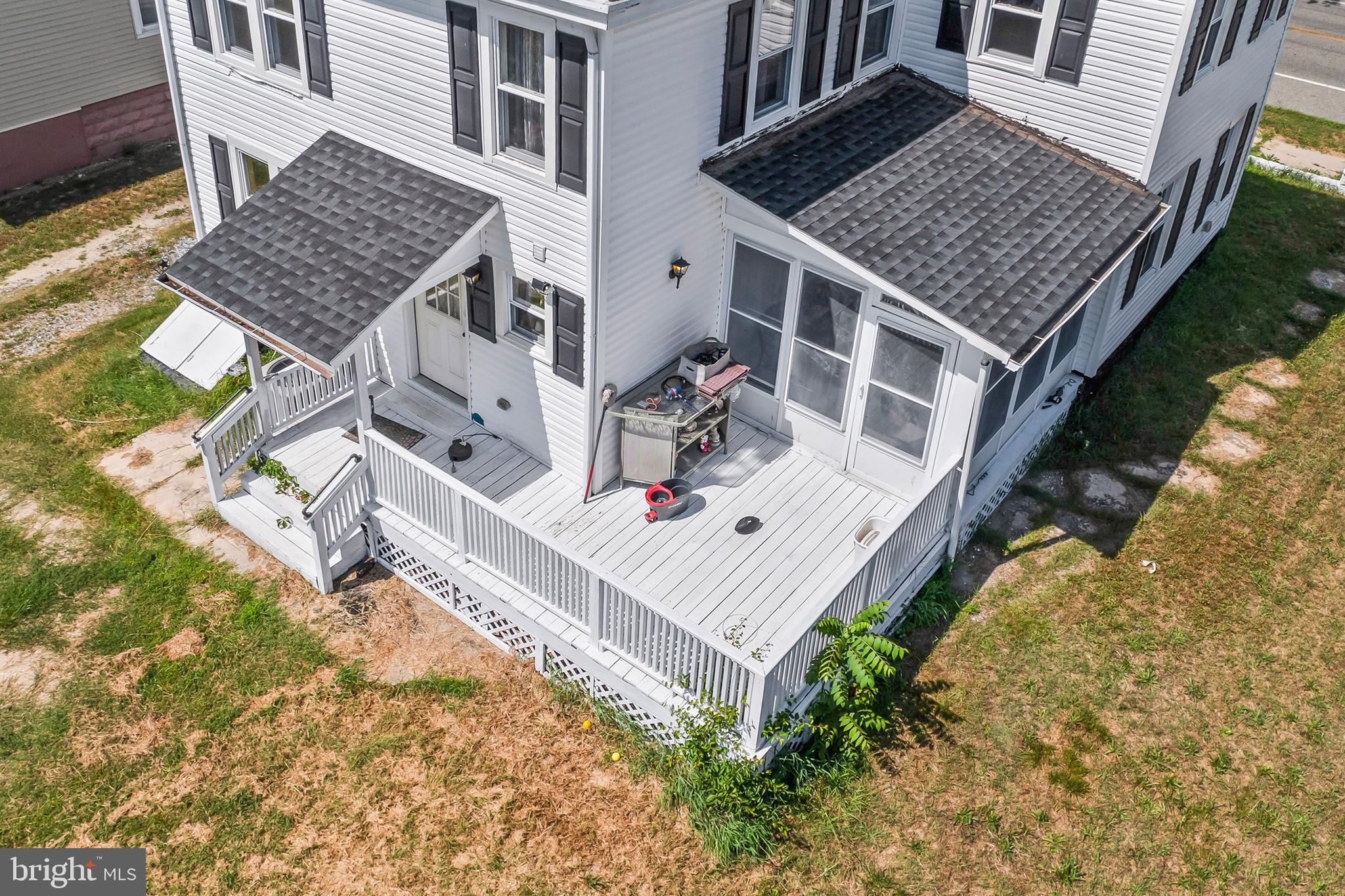 348 Main Street Cedarville, NJ 08311 - Photo 6 of 9 front view of a house with a small yard