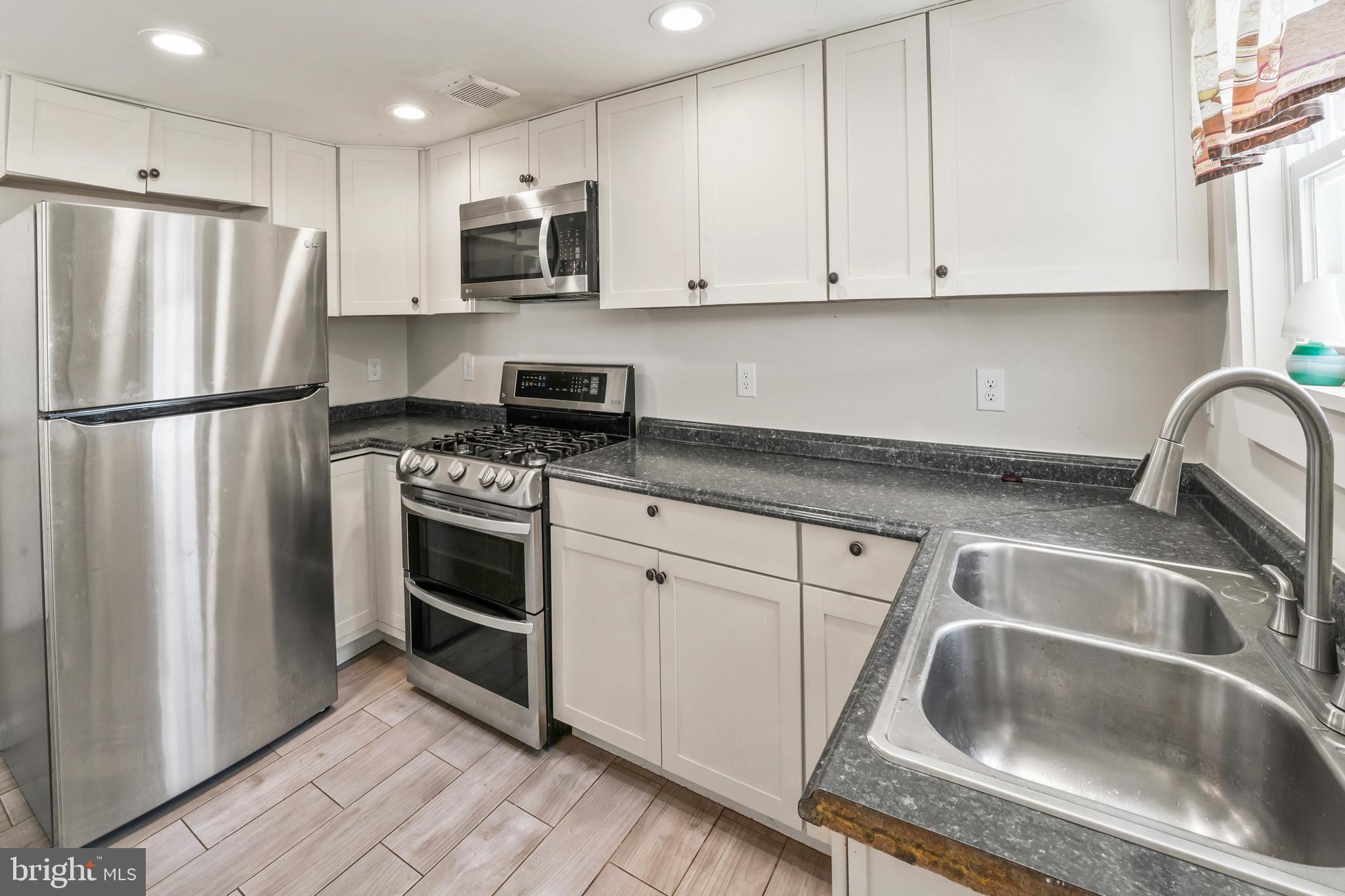 348 Main Street Cedarville, NJ 08311 - Photo 8 of 9 a kitchen with a refrigerator sink and microwave