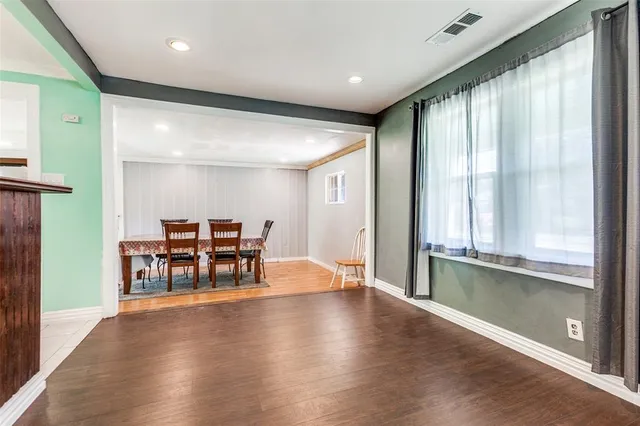 a room with furniture and wooden floor