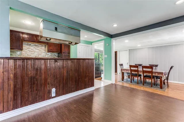 a open kitchen with a table and chairs in it