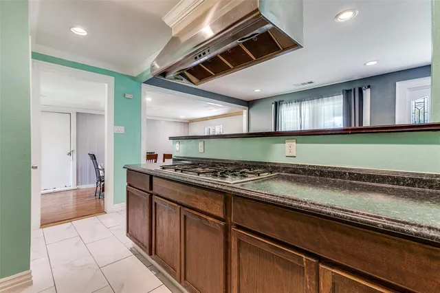 a kitchen with a stove and a sink