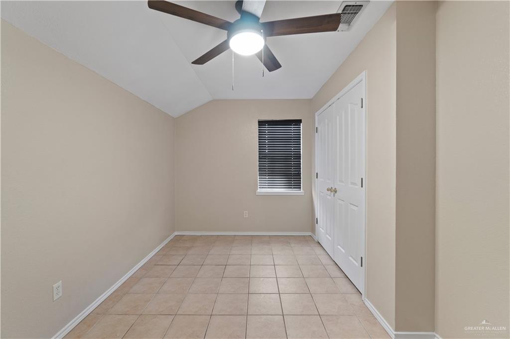 7412 North 19th Street McAllen, TX 78504 - Photo 12 of 22 wooden floor in an empty room with a window