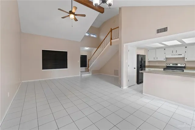 a view of kitchen with microwave and cabinets