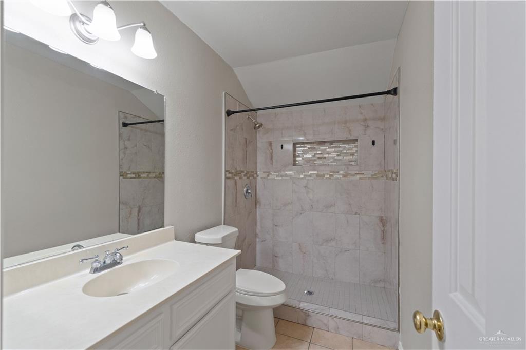 7412 North 19th Street McAllen, TX 78504 - Photo 9 of 22 a bathroom with a sink toilet and shower