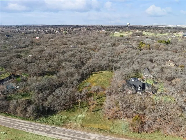 a backyard of a house with a yard and outdoor seating