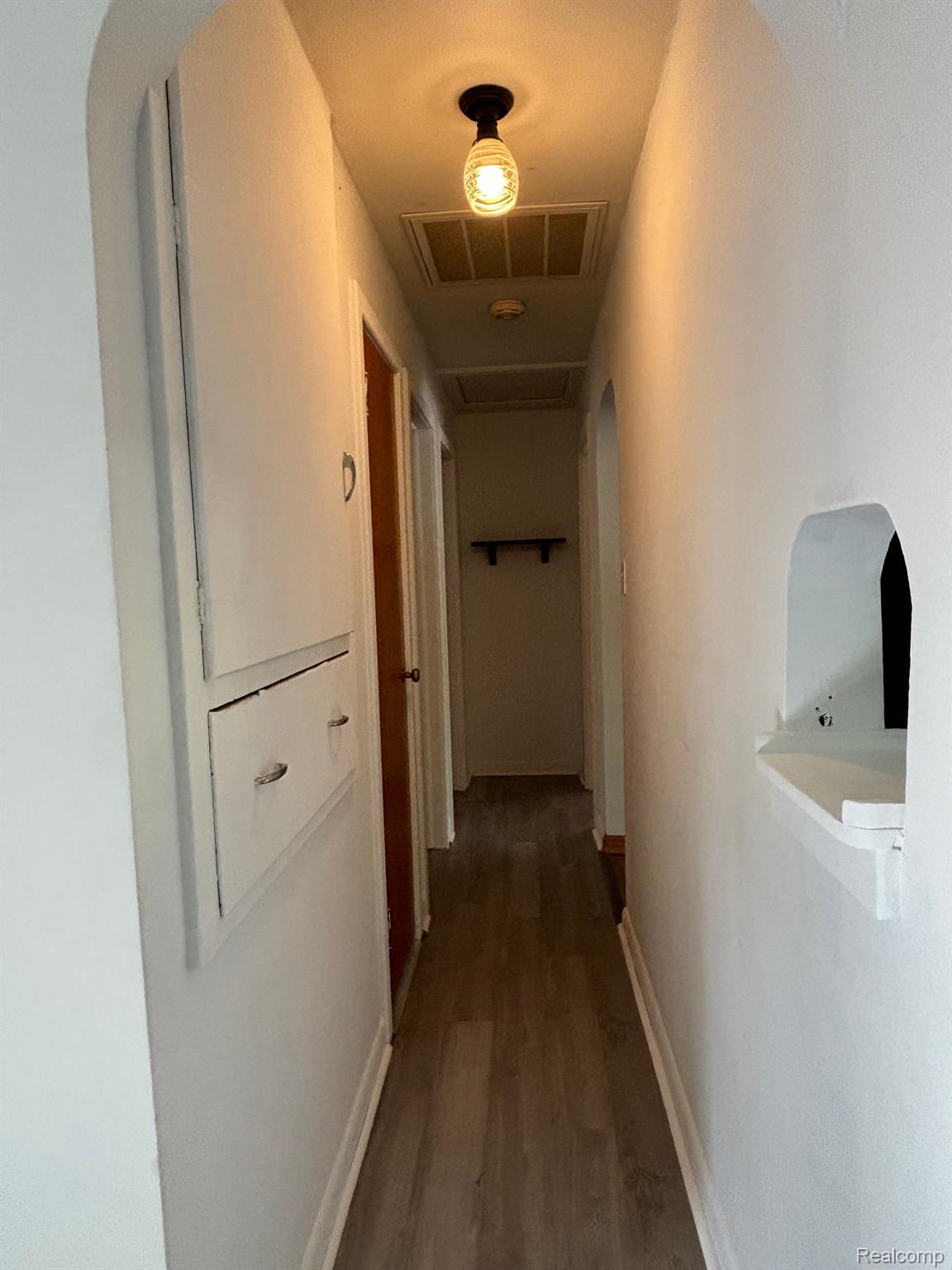 5941 Stony Lake Road Jackson, MI 49201 - Photo 9 of 26 Hallway w/great built in storage for Linens/towels