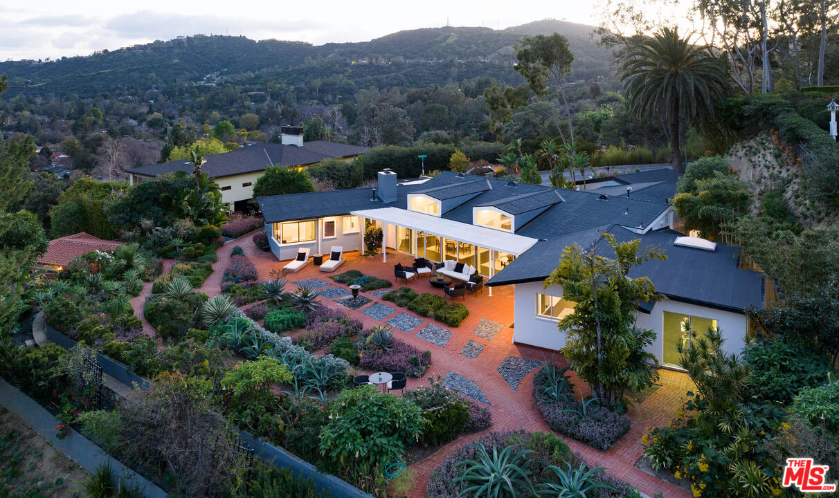 an aerial view of a house with a garden
