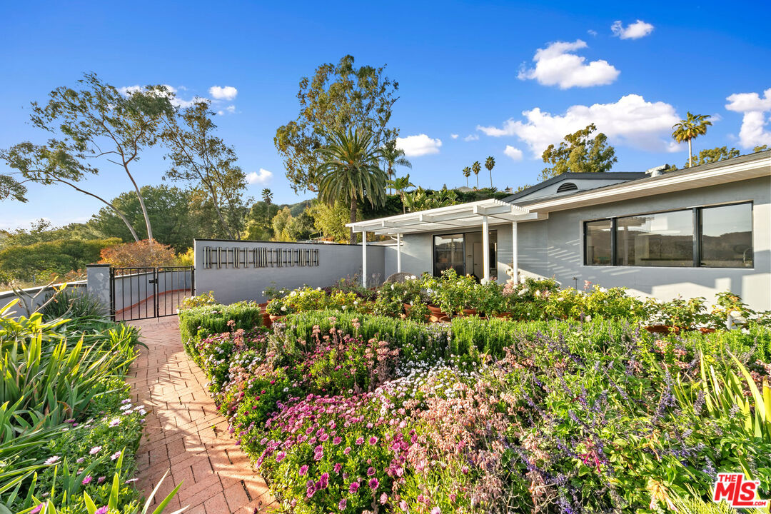 1820 Braemar Road Pasadena, CA 91103 - Photo 11 of 75 a view of a house with a big yard and potted plants